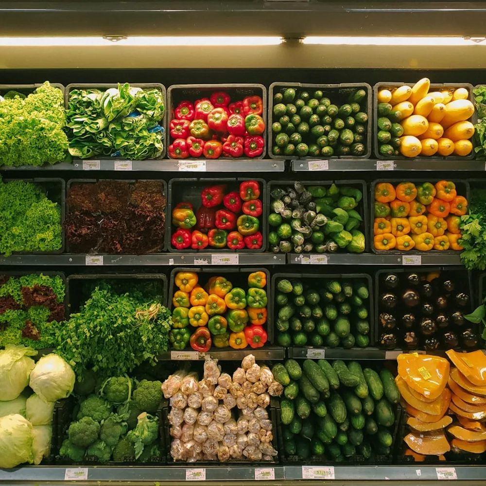 A colorful selection of fresh vegetables at a neighborhood grocery